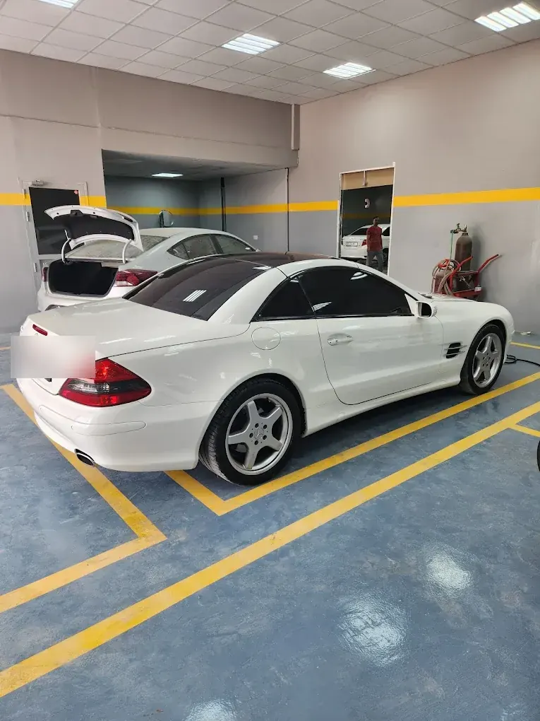 White Mercedes-Benz SL-Class detailed at Madeena Al Amwaj Auto Workshop