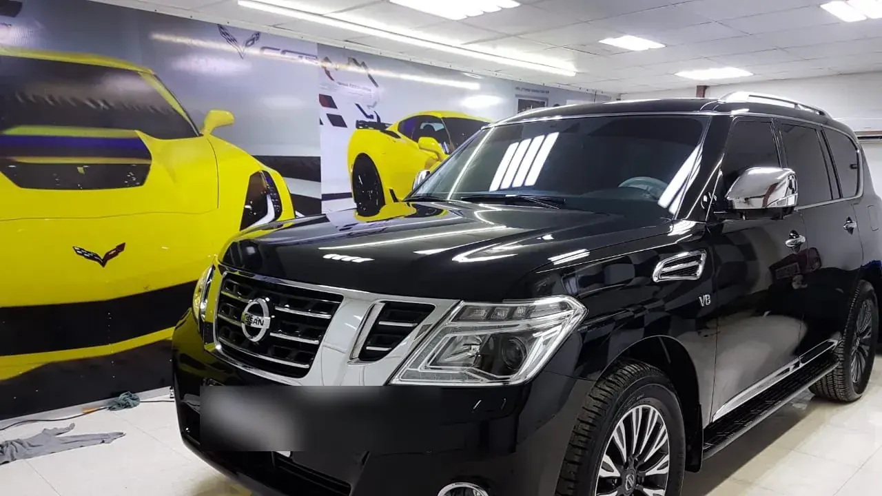Black Nissan Patrol serviced at Madeena Al Amwaj Auto Workshop