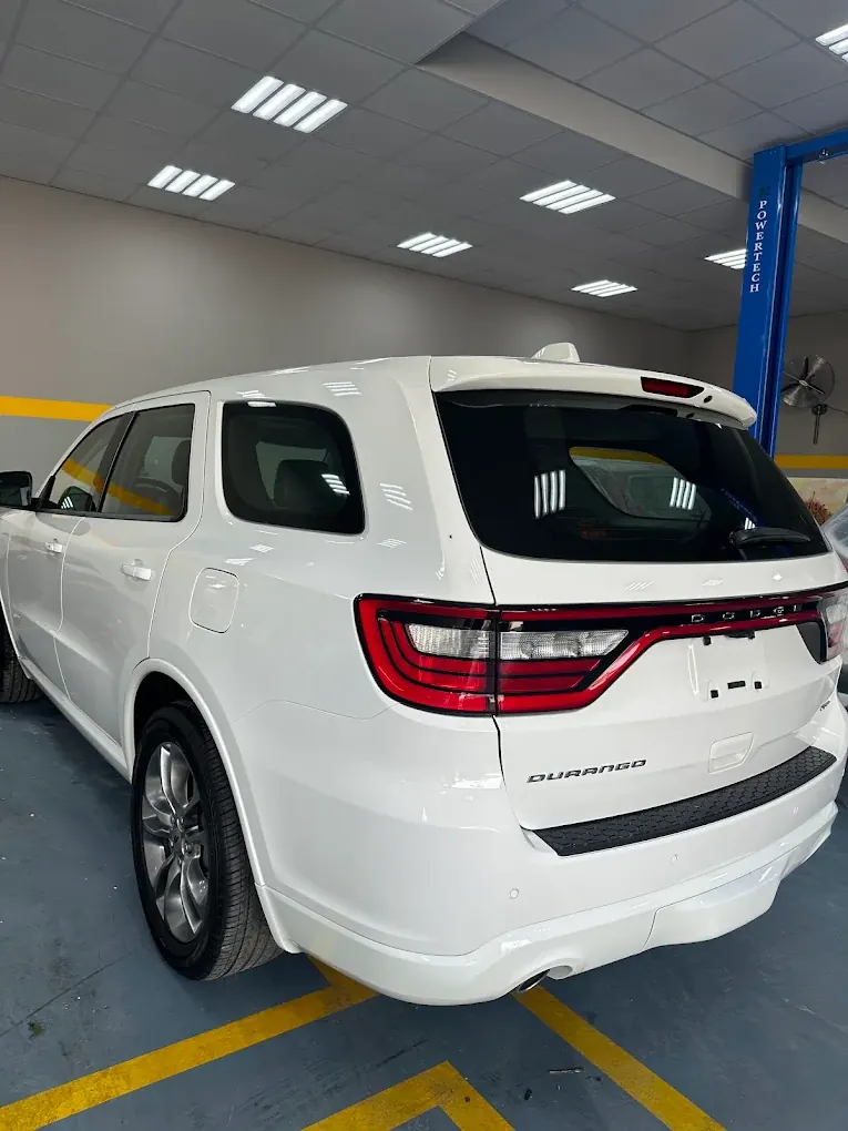 White Dodge Durango detailed at Madeena Al Amwaj Auto Workshop