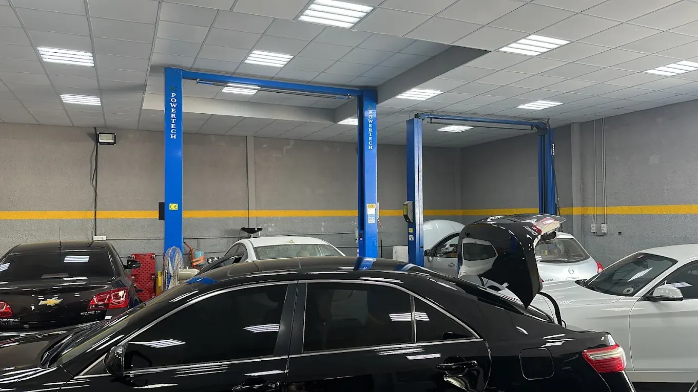 Workshop bay with lifts and vehicles at Madeena Al Amwaj Auto Workshop